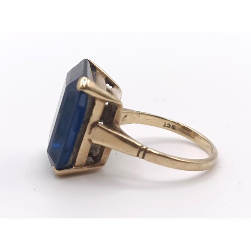 332 - A 9ct gold and blue stone dress ring...