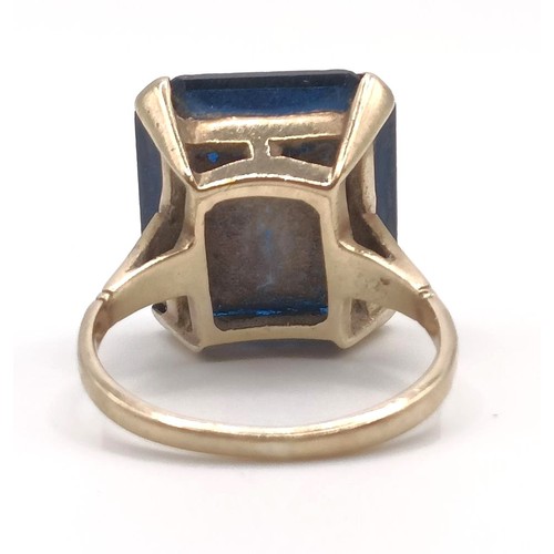 332 - A 9ct gold and blue stone dress ring...