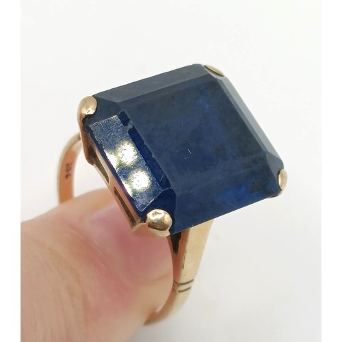 332 - A 9ct gold and blue stone dress ring...