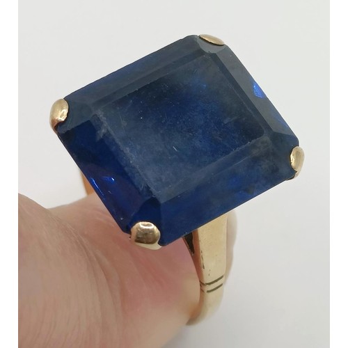 332 - A 9ct gold and blue stone dress ring...