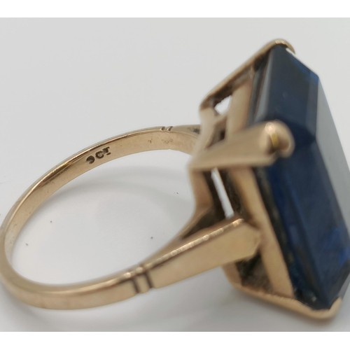 332 - A 9ct gold and blue stone dress ring...