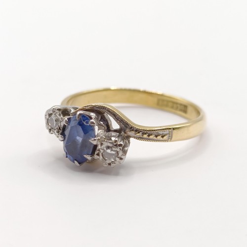 335 - An 18ct gold, sapphire and diamond crossover ring, ring size J...