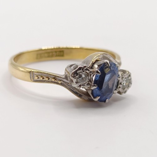 335 - An 18ct gold, sapphire and diamond crossover ring, ring size J...