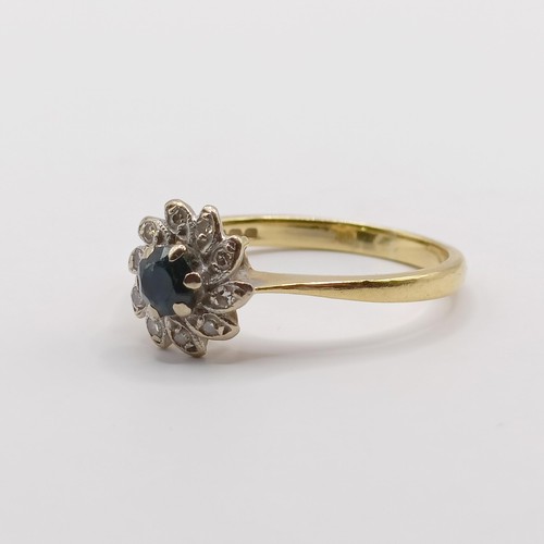 338 - An 18ct gold, diamond and sapphire cluster ring, ring size N...