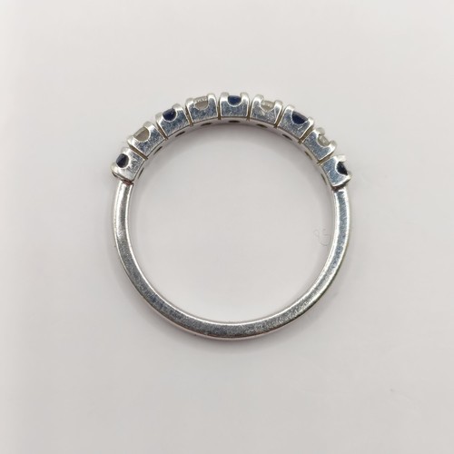 340 - A platinum, diamond and sapphire half hoop ring, ring size M