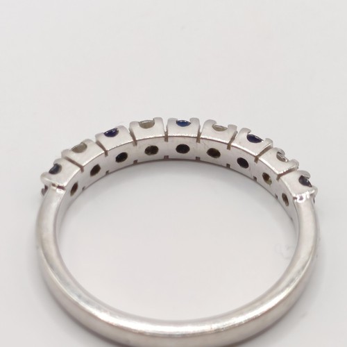 340 - A platinum, diamond and sapphire half hoop ring, ring size M