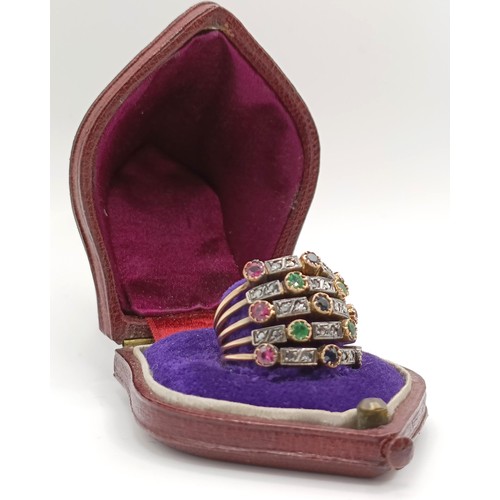 342 - A yellow coloured metal and multi-coloured stone harem ring, in a vintage jewellery box...