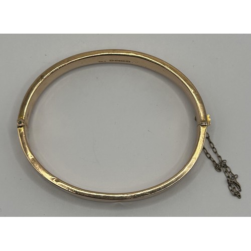 346 - A 9ct gold bangle, 8.9 g...