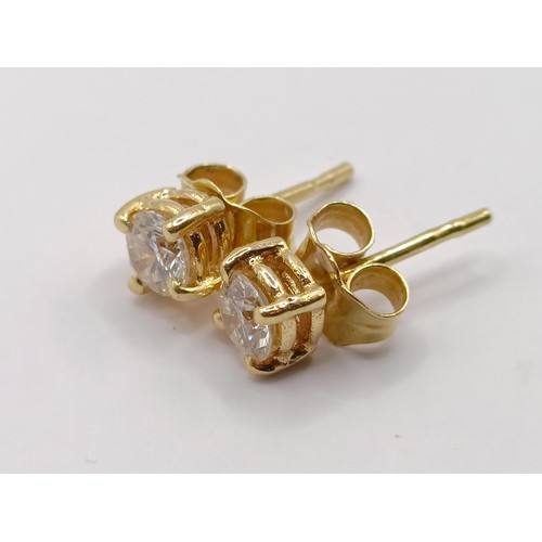 347 - A pair of 18ct gold and diamond stud earrings