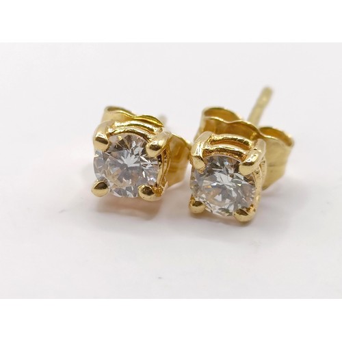 347 - A pair of 18ct gold and diamond stud earrings