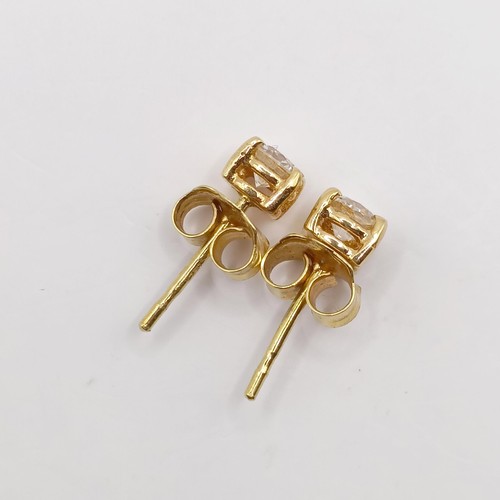 347 - A pair of 18ct gold and diamond stud earrings