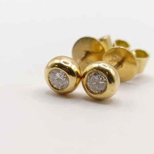 354 - A pair of 18ct gold and diamond ear studs...