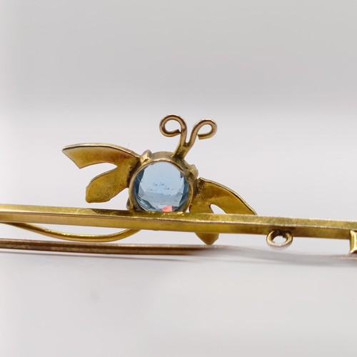 355 - A gold and blue stone bar brooch