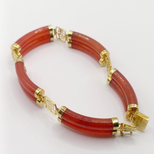 360 - A 14ct gold and carnelian bracelet