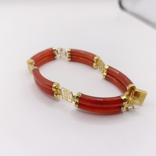 360 - A 14ct gold and carnelian bracelet