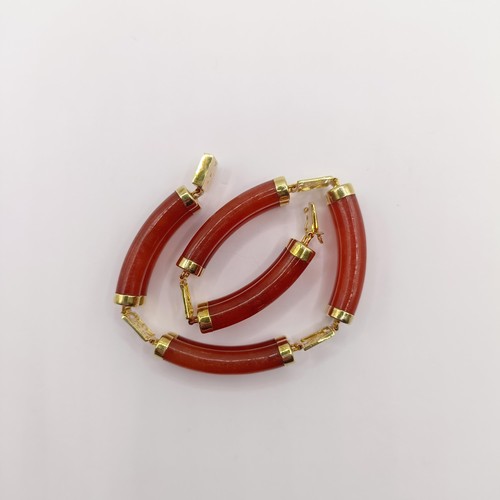 360 - A 14ct gold and carnelian bracelet