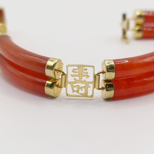 360 - A 14ct gold and carnelian bracelet