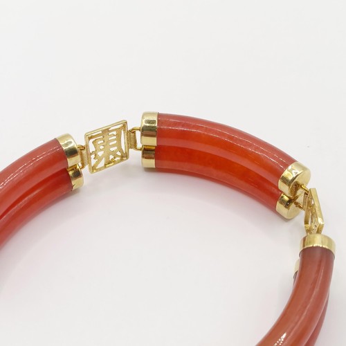 360 - A 14ct gold and carnelian bracelet