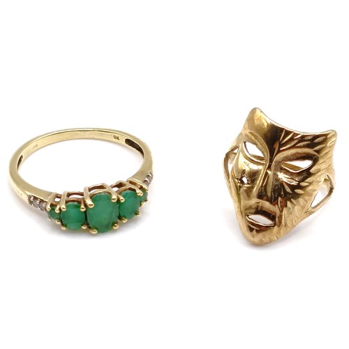 362 - A 9ct gold ring, in the form of a theatrical mask, ring size C, 2 g, and a 9ct and green stone ring,... 