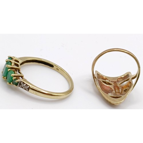 362 - A 9ct gold ring, in the form of a theatrical mask, ring size C, 2 g, and a 9ct and green stone ring,... 