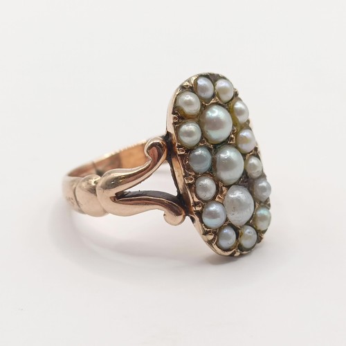 368 - A yellow coloured metal and seed pearl panel ring, probably 19th century, ring size K