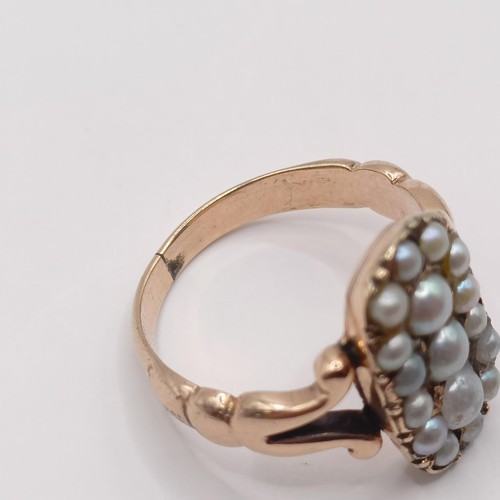 368 - A yellow coloured metal and seed pearl panel ring, probably 19th century, ring size K