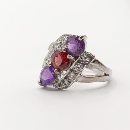 369 - An 18ct white gold, diamond and multi-coloured stone ring, ring size J