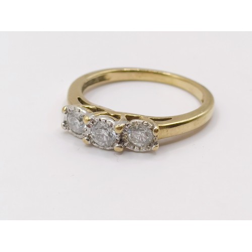 374 - An 18ct gold and diamond three stone ring, the central diamond 0.3ct approx., ring size N