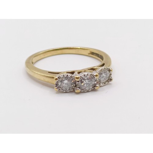 374 - An 18ct gold and diamond three stone ring, the central diamond 0.3ct approx., ring size N