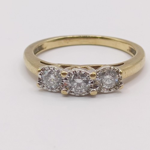 374 - An 18ct gold and diamond three stone ring, the central diamond 0.3ct approx., ring size N