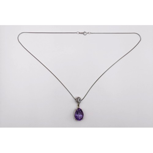 378 - A platinum, amethyst and diamond pendant, and chain