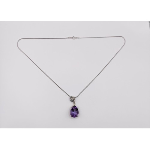 378 - A platinum, amethyst and diamond pendant, and chain