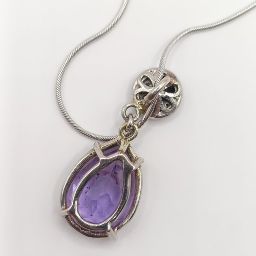 378 - A platinum, amethyst and diamond pendant, and chain