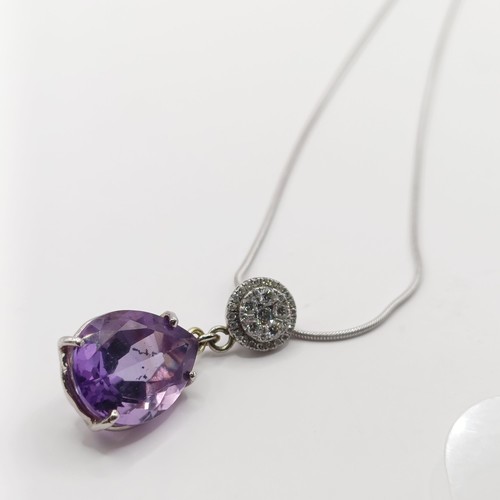 378 - A platinum, amethyst and diamond pendant, and chain