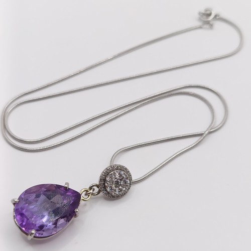 378 - A platinum, amethyst and diamond pendant, and chain