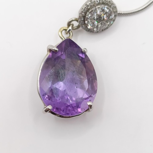 378 - A platinum, amethyst and diamond pendant, and chain