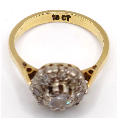 384 - An 18ct gold and diamond cluster ring, ring size K