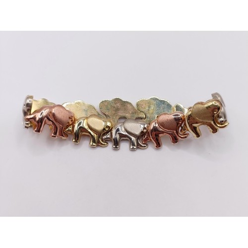 385 - A 10ct multi-coloured gold bracelet, in the form of an elephant train, 8.4 g