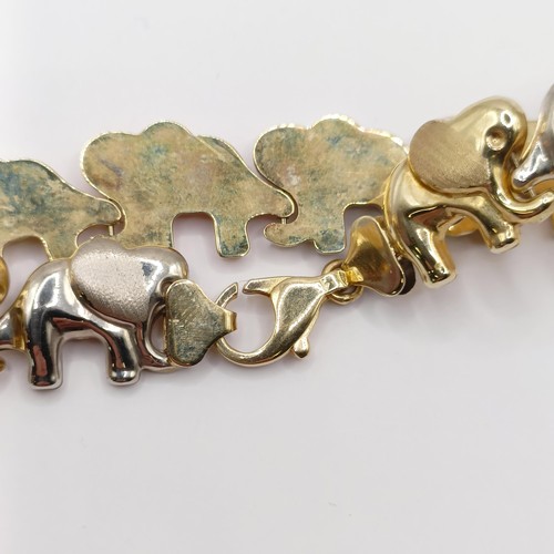 385 - A 10ct multi-coloured gold bracelet, in the form of an elephant train, 8.4 g