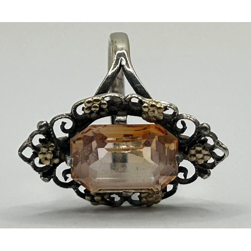 389 - A Bernard Instone silver coloured metal and peach coloured stone ring