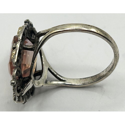 389 - A Bernard Instone silver coloured metal and peach coloured stone ring