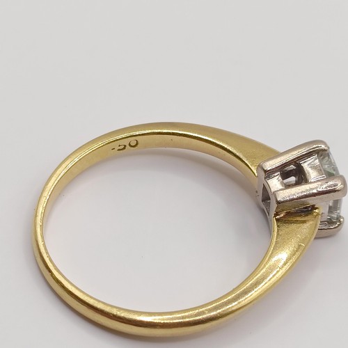 393 - An 18ct gold and solitaire ring, with an emerald cut diamond, ring size J