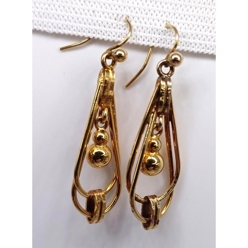 401 - A pair of yellow coloured metal drop earrings, 4 g