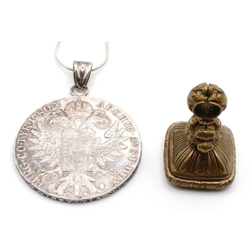 404 - A gilt metal seal, and a Thaler pendant coin on a chain