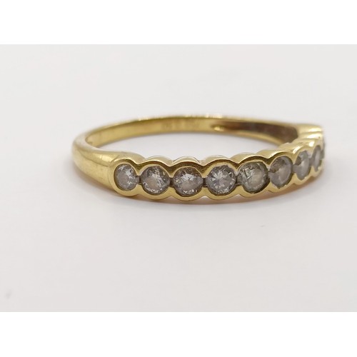 405 - An 18ct gold and diamond half eternity ring, ring size P