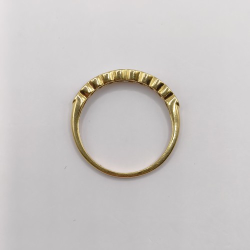 405 - An 18ct gold and diamond half eternity ring, ring size P