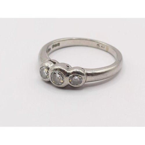 407 - A platinum and diamond three stone ring, ring size M