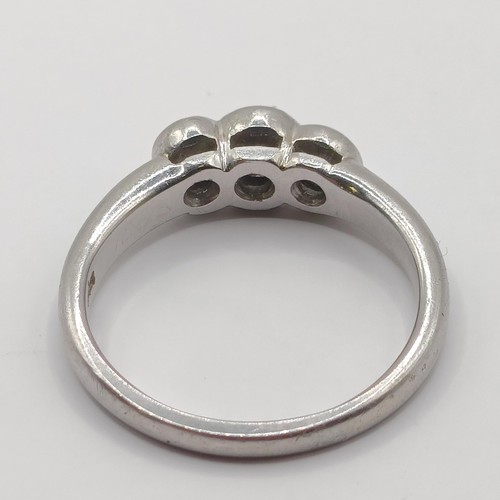 407 - A platinum and diamond three stone ring, ring size M