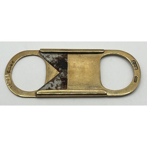 411 - A 9ct gold cigar cutter, 10 g (all in)