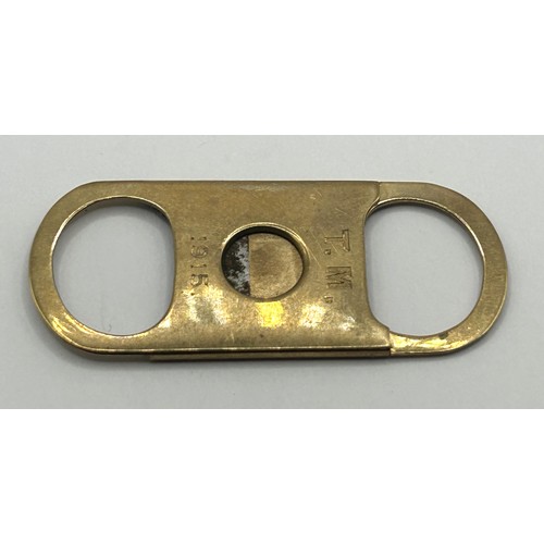 411 - A 9ct gold cigar cutter, 10 g (all in)